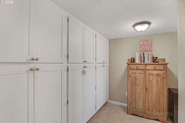 1842 SW Lobelia St, Portland, OR 97219 - hallway featuring a textured ceiling
