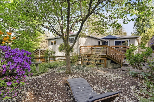 1842 SW Lobelia St, Portland, OR 97219 - rear view of house with a wooden deck and stairway