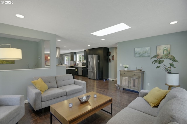 1842 SW Lobelia St, Portland, OR 97219 - living area featuring a skylight, recessed lighting, and dark wood-style floors