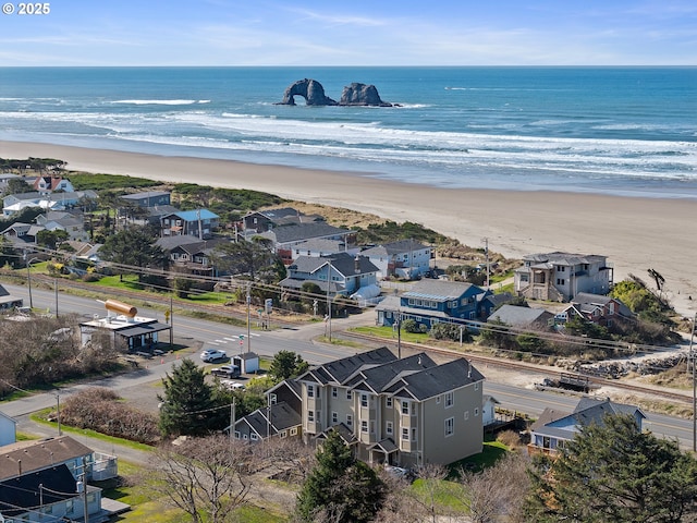 aerial view featuring a residential view, a beach view, and a water view