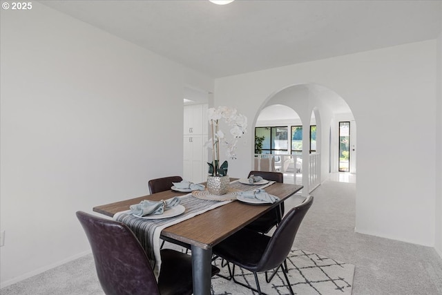 11560 SW Settler Way, Beaverton, OR 97008 - dining room featuring arched walkways and light carpet