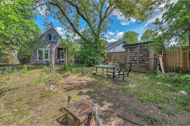 146 NE Jefferson St, Hillsboro, OR 97124 - view of yard with a storage shed, an outdoor structure, and a fenced backyard