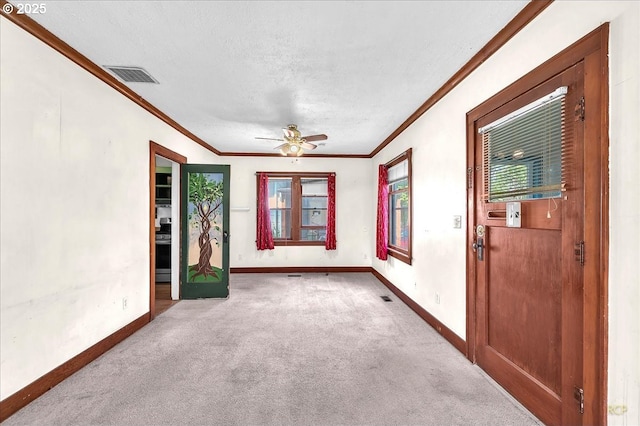 146 NE Jefferson St, Hillsboro, OR 97124 - carpeted empty room featuring a textured ceiling, visible vents, baseboards, and ornamental molding