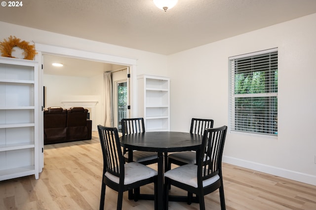 dining space featuring light wood-type flooring