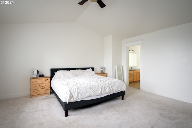 carpeted bedroom featuring ensuite bath, ceiling fan, and lofted ceiling