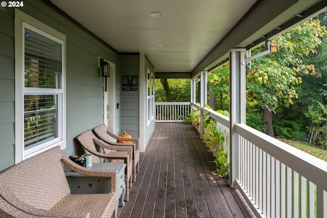 wooden terrace featuring covered porch