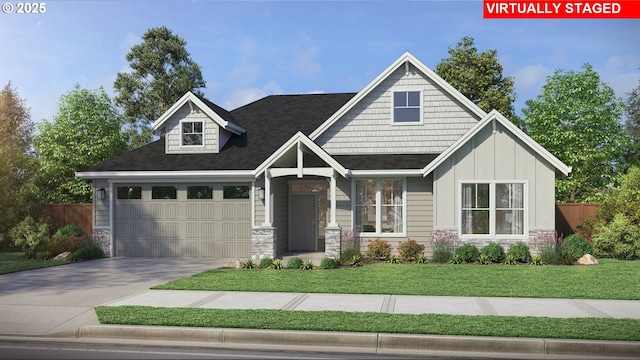 view of front of home with a garage and a front lawn