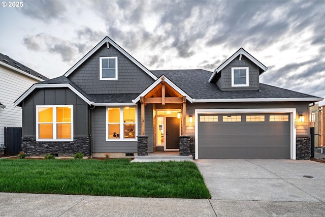 1303 S 46th Pl, Ridgefield, WA 98642 - craftsman inspired home featuring concrete driveway, a front lawn, stone siding, a shingled roof, and a garage