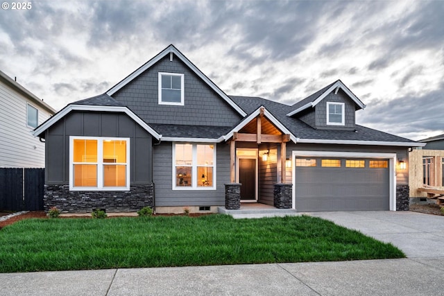1303 S 46th Pl, Ridgefield, WA 98642 - craftsman inspired home featuring stone siding, driveway, roof with shingles, board and batten siding, and an attached garage