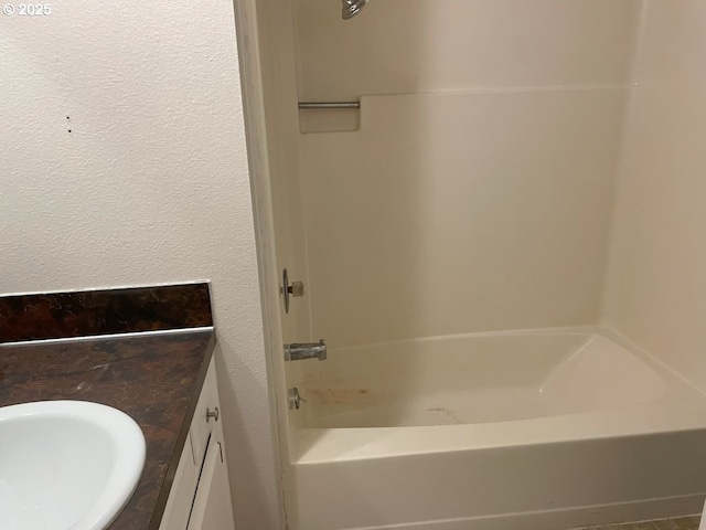 full bathroom featuring a sink and shower / bathing tub combination