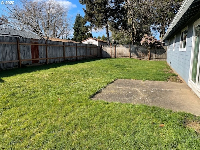 view of yard with a fenced backyard