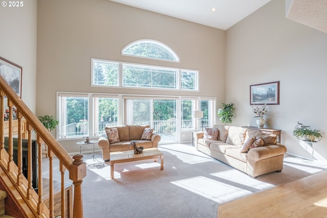 37676 Kathleen Ct, Lebanon, OR 97355 - carpeted living room featuring a towering ceiling and stairway