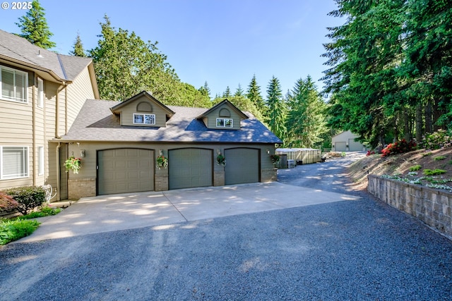 37676 Kathleen Ct, Lebanon, OR 97355 - view of front of property featuring driveway, brick siding, an attached garage, and a shingled roof