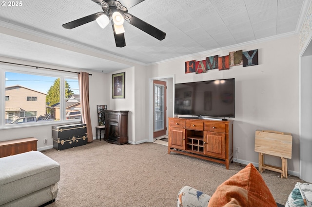 410 E D St, Rainier, OR 97048 - living area featuring ornamental molding, baseboards, ceiling fan, and light carpet