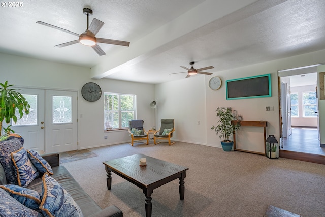 42810 NE 244th Ave, Amboy, WA 98601 - living room with ceiling fan, carpet floors, beamed ceiling, baseboards, and a textured ceiling