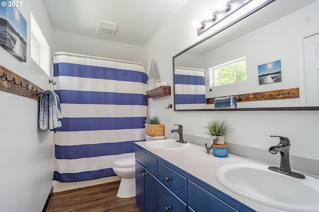 42810 NE 244th Ave, Amboy, WA 98601 - full bath with toilet, double vanity, wood finished floors, and a shower with shower curtain