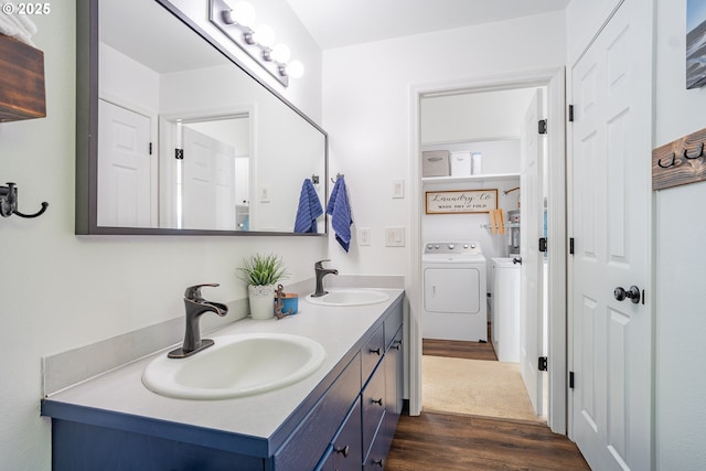 42810 NE 244th Ave, Amboy, WA 98601 - bathroom with washing machine and dryer, wood finished floors, and double vanity