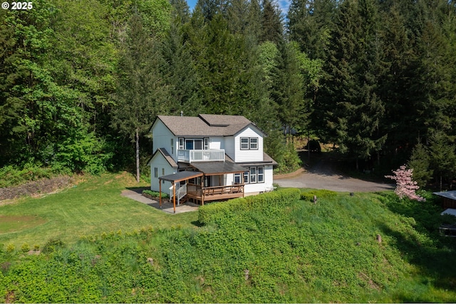 42810 NE 244th Ave, Amboy, WA 98601 - back of property featuring a balcony, a yard, and a wooded view