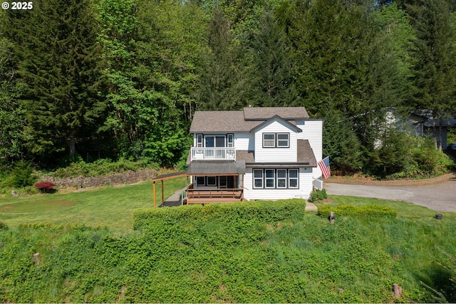 42810 NE 244th Ave, Amboy, WA 98601 - view of front facade featuring a front yard, a wooded view, and a balcony
