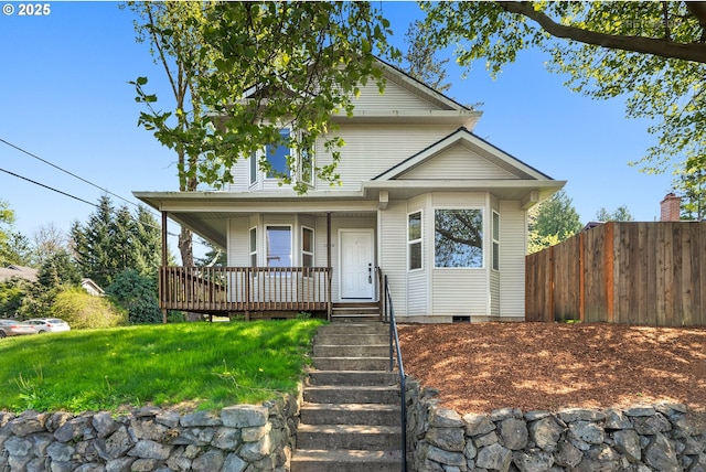 view of front of home featuring a porch, stairway, and fence
