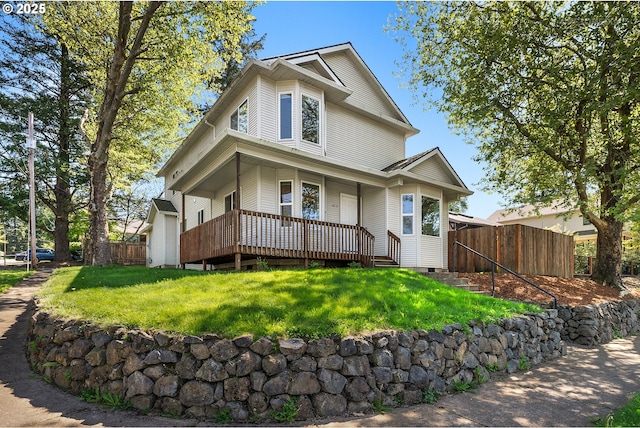 view of front of property featuring a porch, crawl space, fence, and a front yard