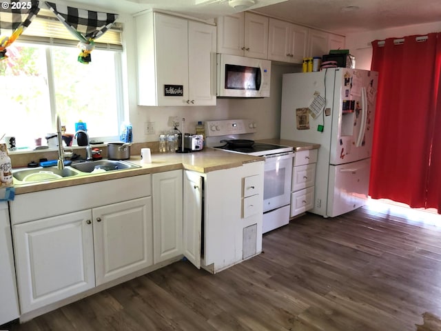 729 NW Evans St, Sheridan, OR 97378 - kitchen featuring white appliances, a sink, dark wood finished floors, and white cabinetry