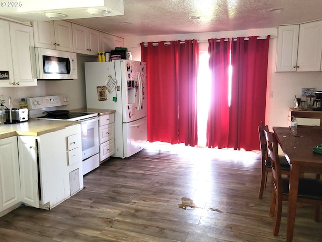 729 NW Evans St, Sheridan, OR 97378 - kitchen featuring white appliances, white cabinets, dark wood finished floors, a textured ceiling, and light countertops