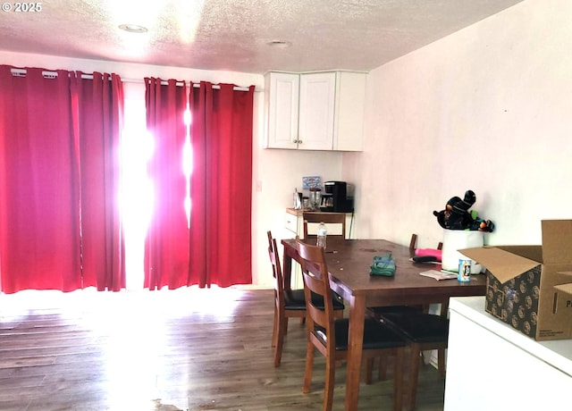 729 NW Evans St, Sheridan, OR 97378 - dining room with wood finished floors and a textured ceiling