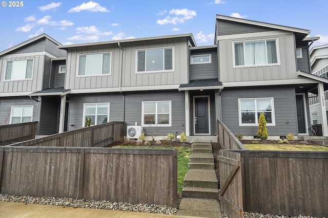 view of front of property featuring ac unit