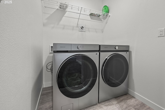 laundry area with independent washer and dryer