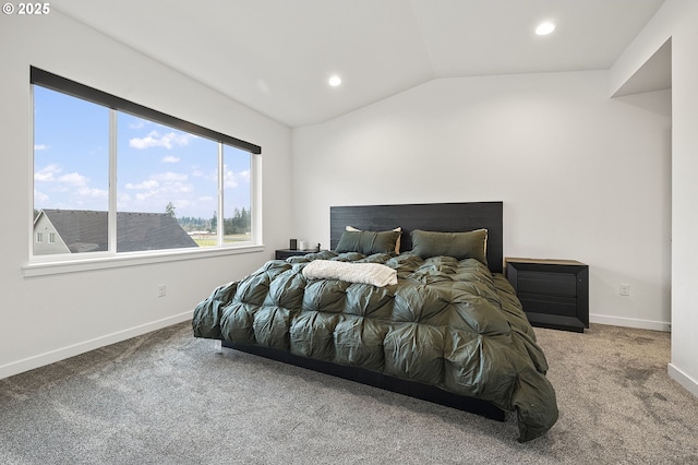 carpeted bedroom featuring vaulted ceiling