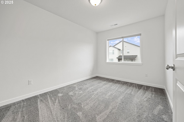 unfurnished room featuring carpet