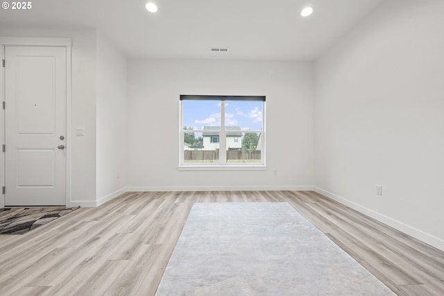 unfurnished room with light hardwood / wood-style floors