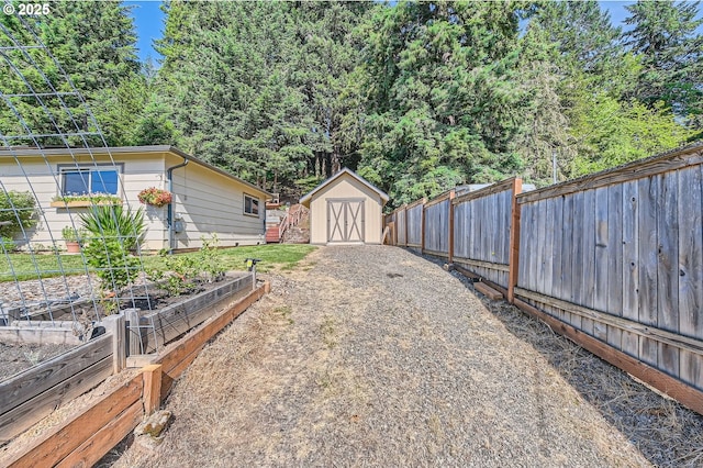 190 SE Shafford St, Estacada, OR 97023 - fenced backyard featuring a garden and a shed