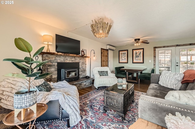 190 SE Shafford St, Estacada, OR 97023 - living room featuring french doors, a wall mounted air conditioner, wood finished floors, and ceiling fan