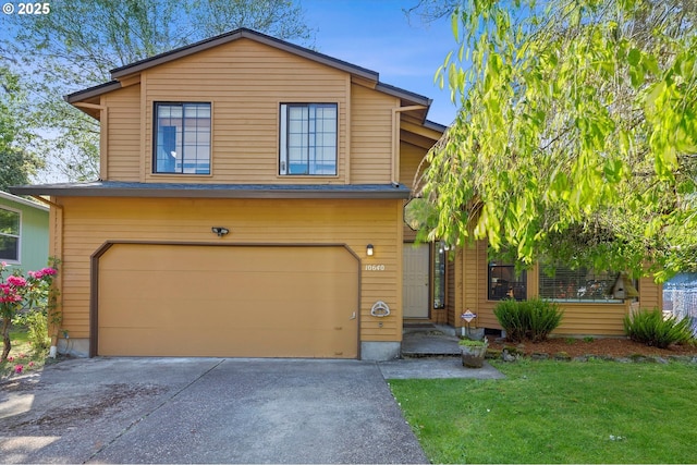 view of front of home featuring an attached garage, a front lawn, and asphalt driveway
