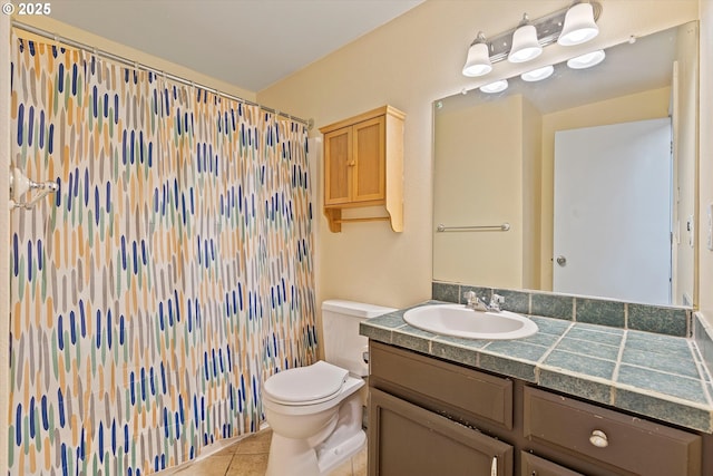 bathroom with toilet, vanity, tile patterned flooring, and curtained shower