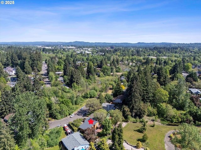 view of property location featuring a heavily wooded area