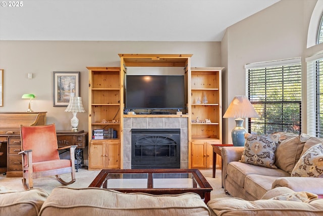 living room with light carpet and a fireplace