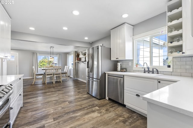 12275 SE School Ave, Boring, OR 97009 - kitchen featuring appliances with stainless steel finishes, white cabinets, dark wood-style floors, light countertops, and recessed lighting