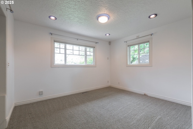 7105 Mississippi Dr, Vancouver, WA 98664 - carpeted empty room featuring plenty of natural light, recessed lighting, a textured ceiling, and baseboards