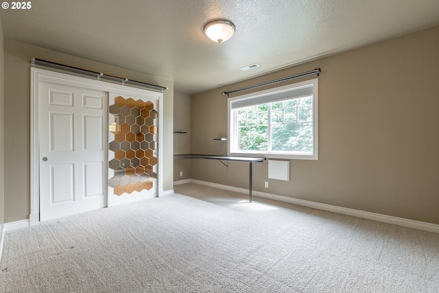 7105 Mississippi Dr, Vancouver, WA 98664 - unfurnished bedroom with carpet floors, baseboards, and a textured ceiling