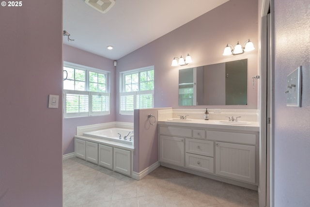 7105 Mississippi Dr, Vancouver, WA 98664 - full bath featuring double vanity, a garden tub, lofted ceiling, tile patterned floors, and baseboards