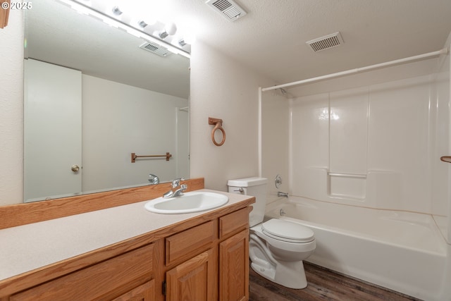 7105 Mississippi Dr, Vancouver, WA 98664 - bathroom with toilet, wood finished floors, vanity, and shower / tub combination