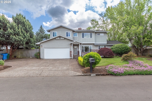 7105 Mississippi Dr, Vancouver, WA 98664 - view of front of home with an attached garage, concrete driveway, stone siding, a chimney, and board and batten siding