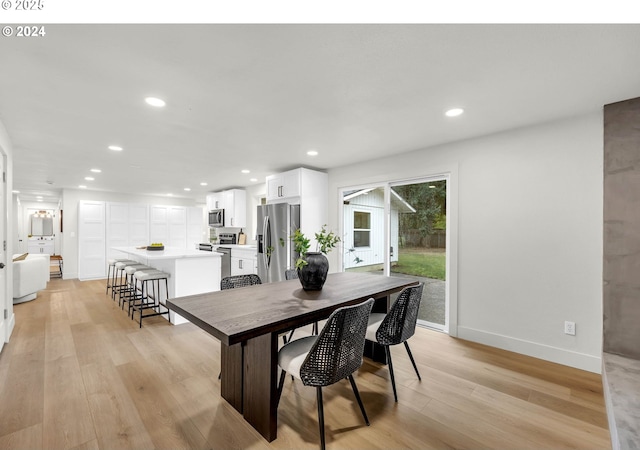 dining area with light hardwood / wood-style floors