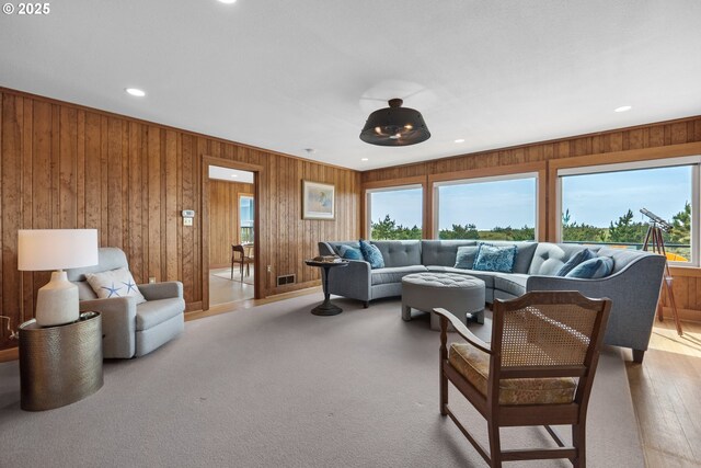 1209 N Prom, Seaside, OR 97138 - carpeted living room featuring wooden walls and recessed lighting