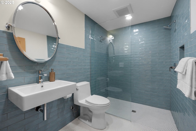 1209 N Prom, Seaside, OR 97138 - full bath with tile walls, tiled shower, toilet, and tile patterned flooring