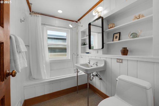 1209 N Prom, Seaside, OR 97138 - bathroom featuring toilet, shower / tub combo with curtain, a sink, a decorative wall, and built in features