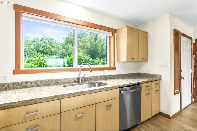 2801 Willows Rd Unit 1, Seaview, WA 98644 - kitchen with stainless steel dishwasher, light brown cabinetry, light wood-style flooring, and light stone countertops